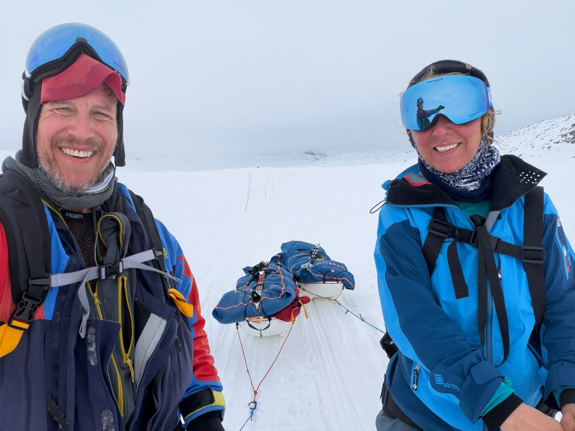 Ben Weber and Erica Stanford with their loaded pulks on the Hardangervidda plateau, Norway